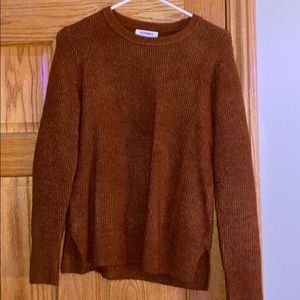 a red/orange sweater